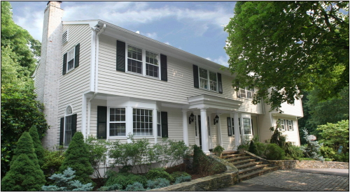 two-story white colonial style home bought or sold by testimony and client NW